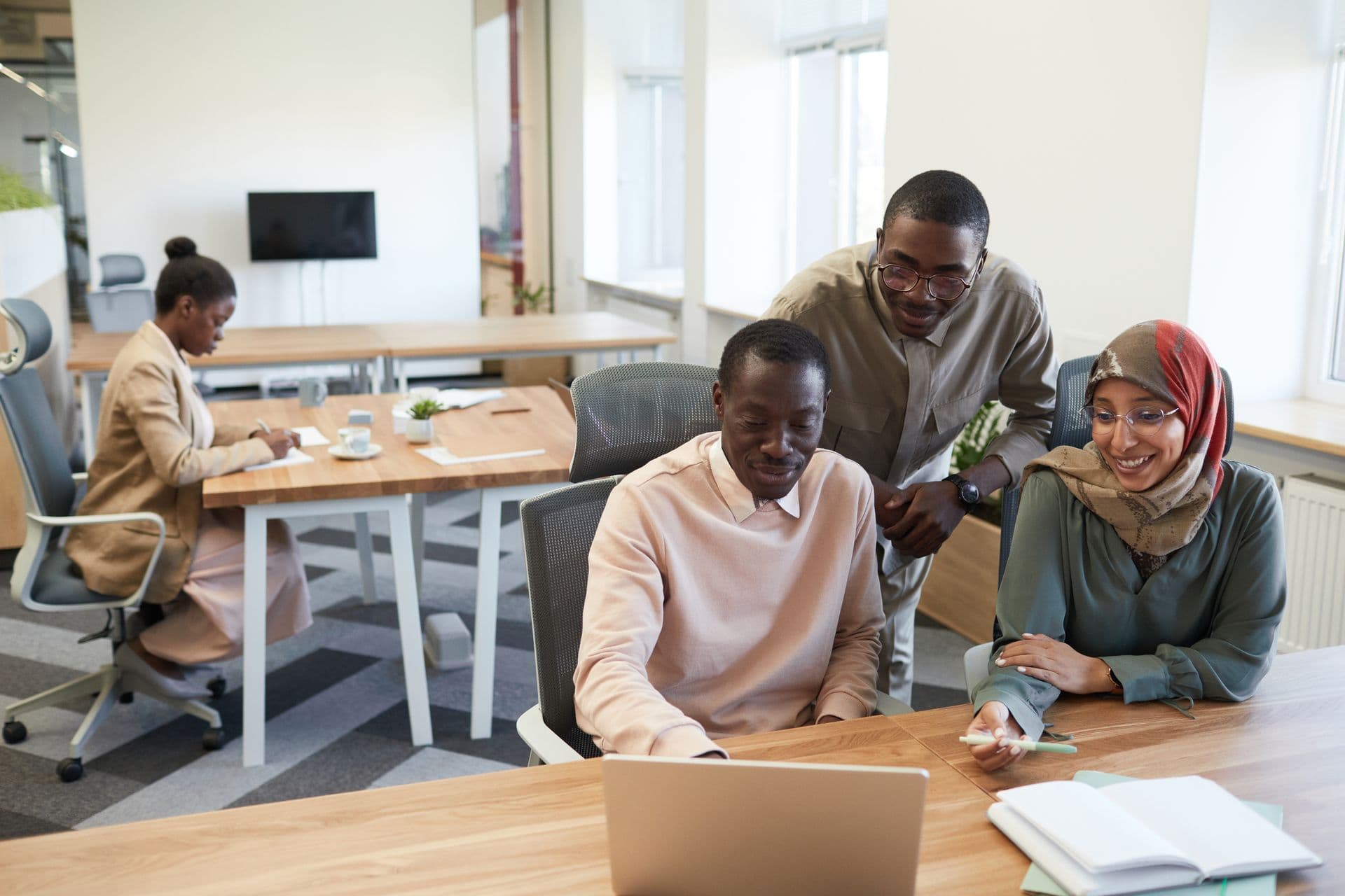 Professionals collaborating in a modern South African office